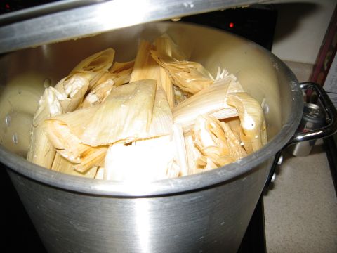 1986 Ford Bronco - A large pot is filled with tamales wrapped in corn husks, ready for steaming.