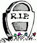1991 Ford LTD Crown Victoria - A tombstone with the inscription R.I.P. and small flowers at its base.