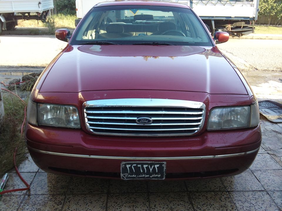 Red 1998 Ford Crown Victoria front view