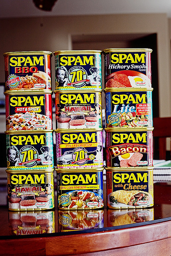 2006 Ford E350 - A collection of Spam cans is neatly stacked on a reflective surface.