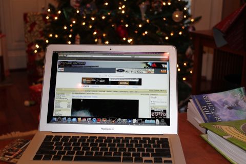 1999 Ford Crown Victoria - Laptop displaying a car forum page with a Christmas tree in the background.