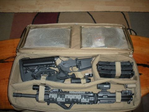 1996 Ford Bronco - Rifles and magazines are organized within a tan tactical case.