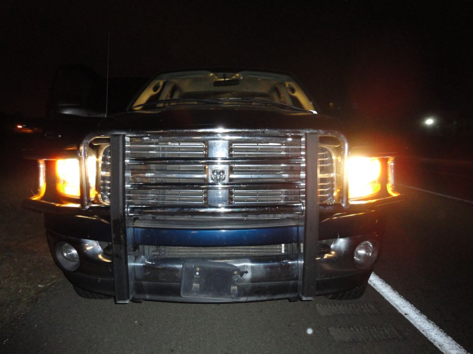 2006 Dodge 2500 front grille with bull bar and headlights on