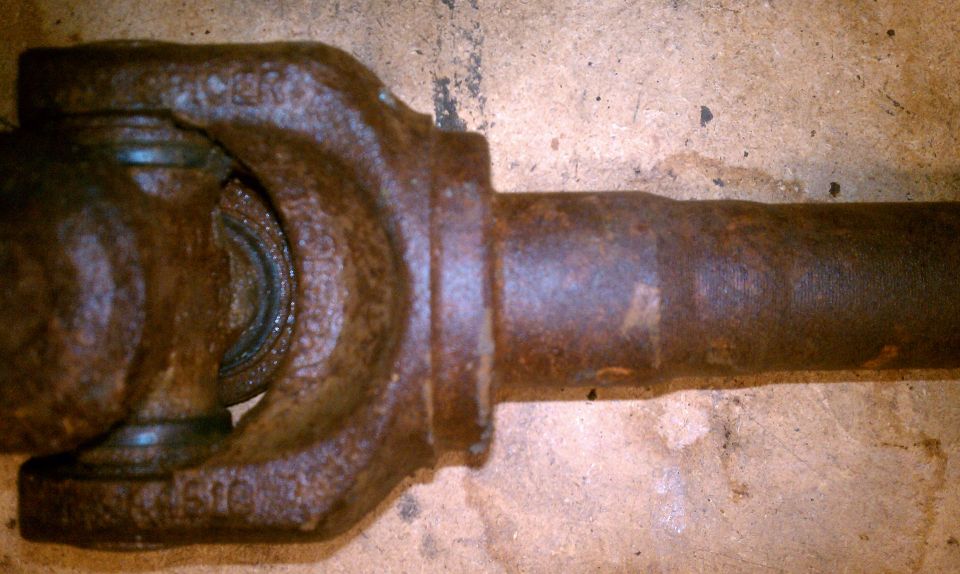 Driveshaft universal joint with visible part numbers