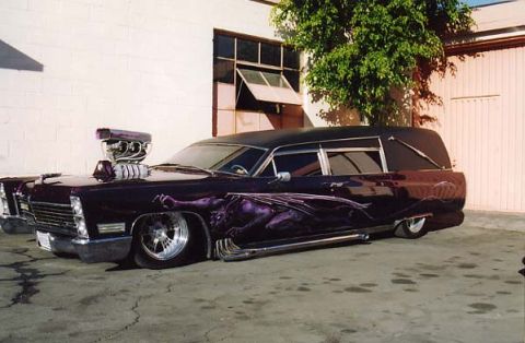 1991 Ford LTD Crown Victoria - This heavily customized hearse features a prominent supercharger and detailed side graphics.