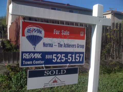 1968 Ford Mustang - Real estate signs indicate a property is for sale and another has been sold.