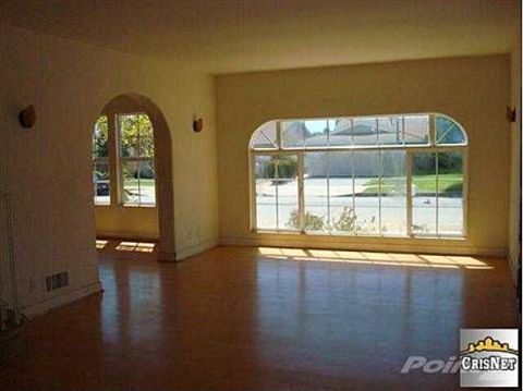 1968 Ford Mustang - View from inside a house through large windows, showing a street and neighboring houses.