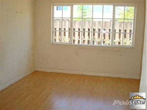 1968 Ford Mustang - Room interior with a window overlooking a fenced yard.