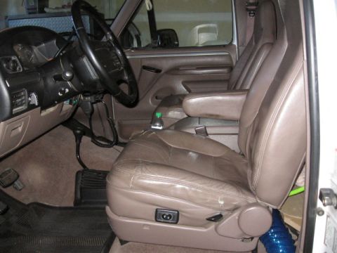 1995 Ford Bronco - Interior view of a 1995 Ford Bronco, focusing on the driver's seat and controls.