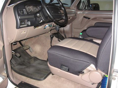1995 Ford Bronco - Interior view of a 1995 Ford Bronco, highlighting the dashboard and seats.