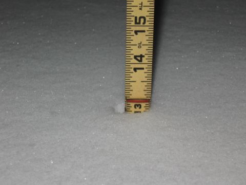1994 Ford Bronco - A ruler measures snow depth, indicating approximately 13.5 inches of accumulation.