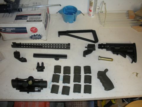 1996 Ford Bronco - Various disassembled firearm components are arranged on a flat surface.
