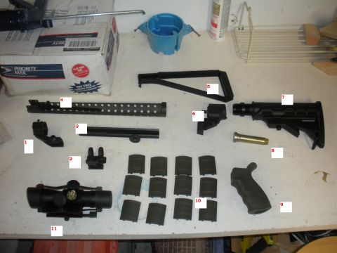 1996 Ford Bronco - Various components for a firearm are displayed, including a scope, adjustable stock, and multiple magazines.