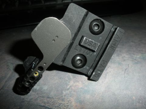 1996 Ford Bronco - Close-up of a black metal gun sight mount with USA and L1707 markings visible.