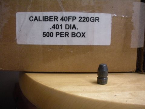 1996 Ford Bronco - A close-up view of a box of ammunition and a single bullet, with text indicating caliber and quantity.