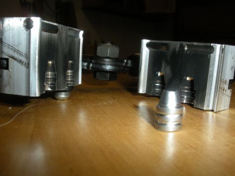 1996 Ford Bronco - Two machined metal components are shown, possibly part of a larger assembly or repair.