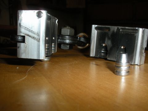 1996 Ford Bronco - Close-up view of mechanical components and a projectile on a table.