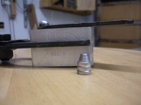 1996 Ford Bronco - A close-up shows a bullet mold with the brand name 'LEE' and a number stamped on it, alongside a single bullet.