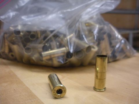 1996 Ford Bronco - A collection of spent shell casings are shown, with two individual casings in the foreground.