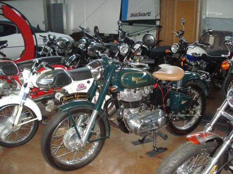 1979 Ford Bronco - Collection of Royal Enfield motorcycles, including a prominent dark green model.