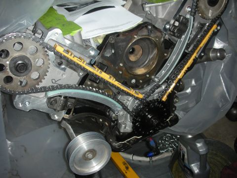 1992 Ford Crown Victoria - Close-up view of an engine's timing chain and gears, showing the internal mechanics of the assembly.