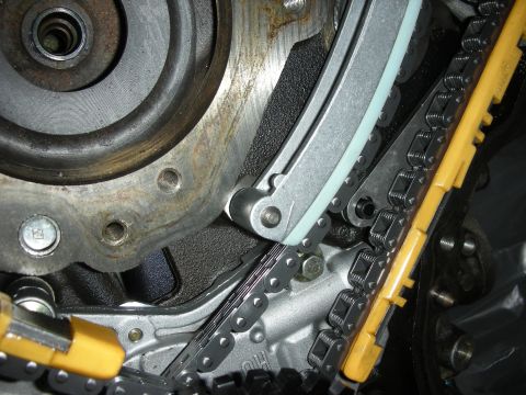 1992 Ford Crown Victoria - Engine timing components, including a chain and plastic guides, are visible in this close-up shot.