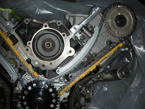 1992 Ford Crown Victoria - Close-up view of an engine's timing chain and gear assembly, showing intricate mechanical components.