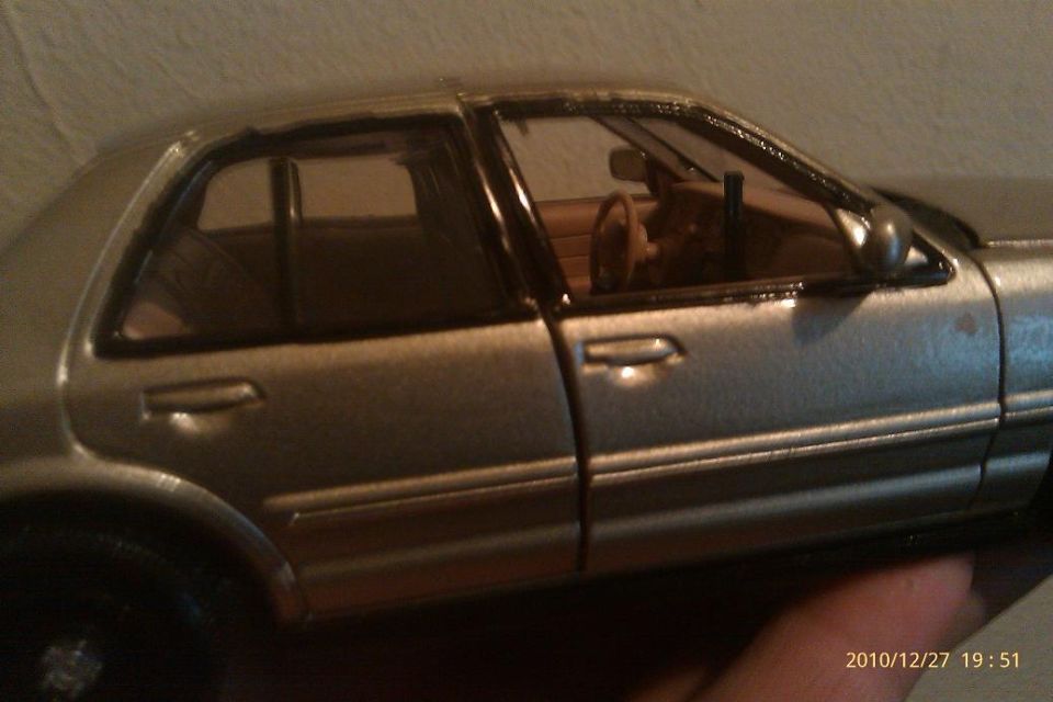 Silver sedan model side view
