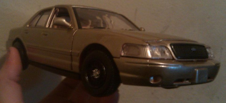 Gold 2000 Mercury Grand Marquis model, 3q front view