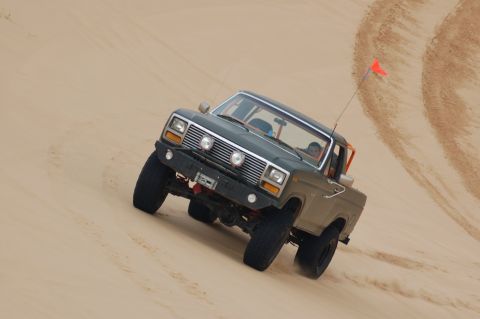 1982 Ford Bronco - This 1980 Ford Bronco navigates a sandy incline, its off-road capabilities.