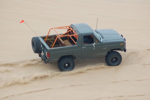 1982 Ford Bronco - This modified Ford Bronco is equipped with an external roll cage and spare tire for off-road adventures.