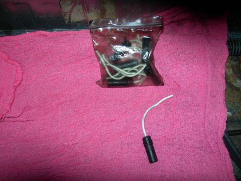 1984 Ford Bronco - Electrical connectors and wires are laid out on a pink cloth.