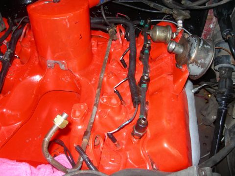 1984 Ford Bronco - Close-up view of an engine bay, showing intricate mechanical components and wiring.