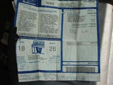 1992 Ford Taurus - Window sticker details for a 1992 Ford Taurus, including price, options, and mileage.