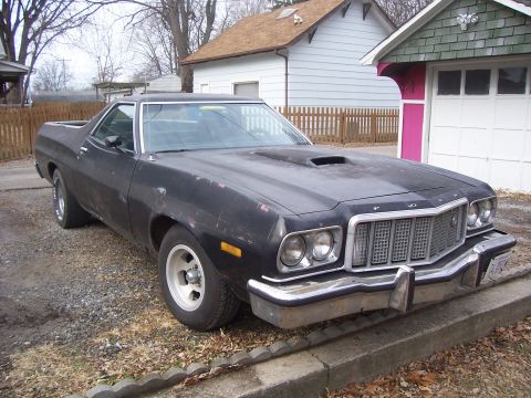 1975 Ford Ranchero - This 1975 Ford Ranchero features a prominent hood scoop and a distinctive grille.