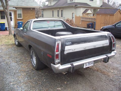 1975 Ford Ranchero - This 1975 Ford Ranchero has a spare tire in the bed and a license plate reading 74 750 W.