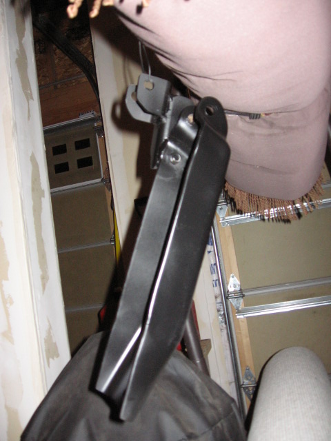 1995 Ford Bronco - Close-up view of black metal dual front shock mounts, likely for an off-road vehicle.