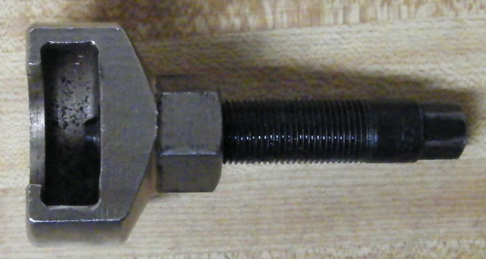 Metal chain breaker tool with a threaded rod and a hexagonal nut