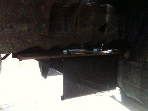 1996 Ford Bronco - Close-up view of the receiver hitch assembly on the underbody of a 1996 Ford Bronco.