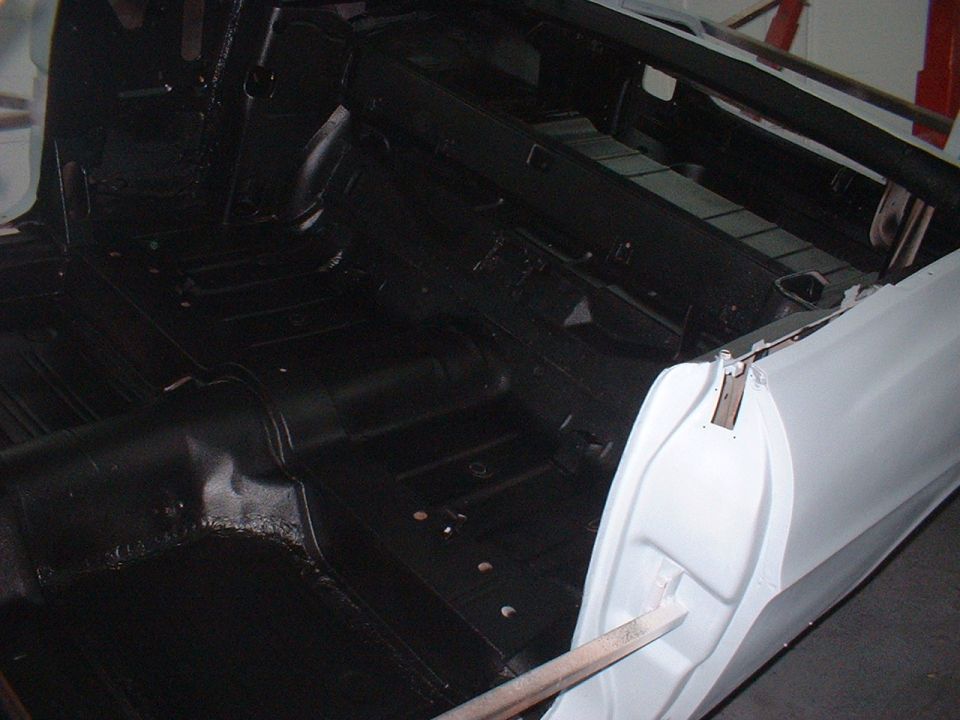1967 Ford Galaxie interior, black floor, white door frame, under repair