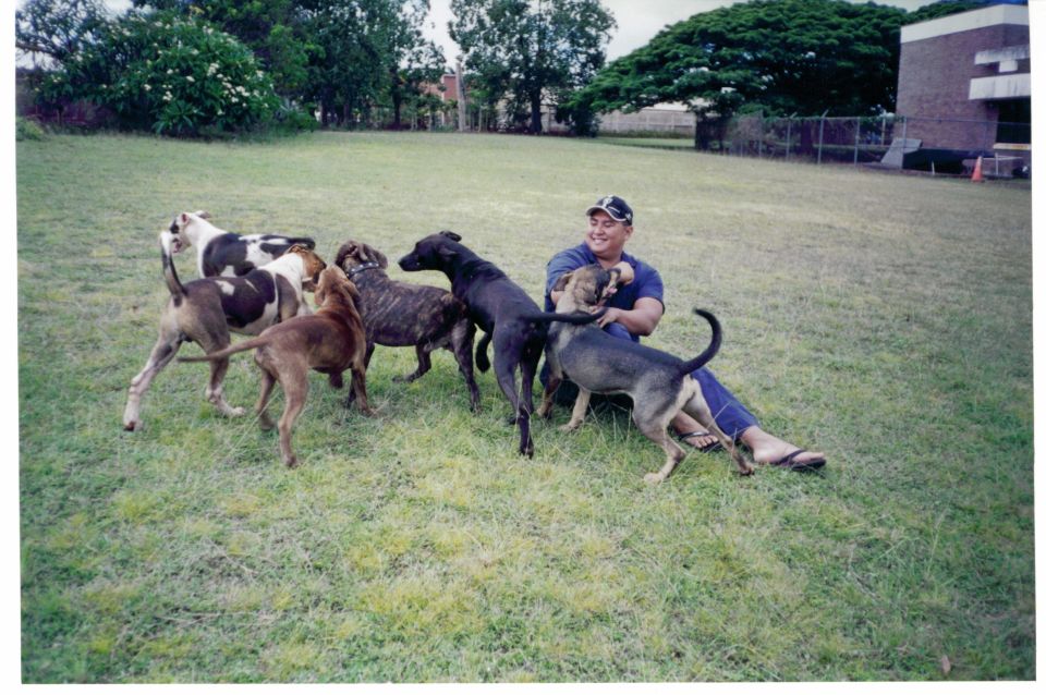 Me and Pono horsing around with some of Richards dogs.