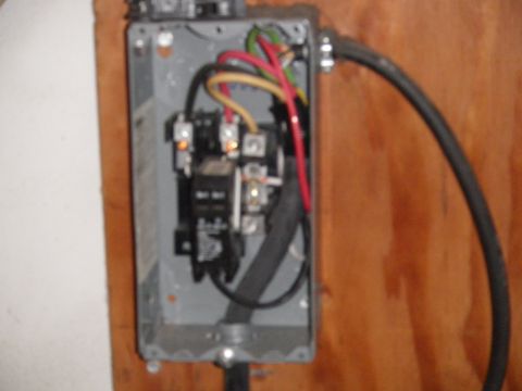 1991 Ford Bronco - Electrical junction box with visible wiring and a black switch mechanism inside.