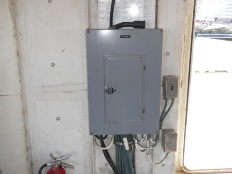 1991 Ford Bronco - An electrical panel and fire extinguisher are visible on a concrete wall.