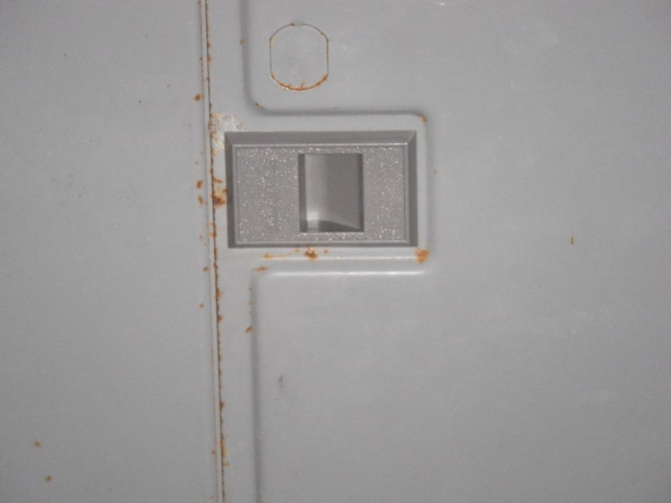 Interior door handle trim with rust spots