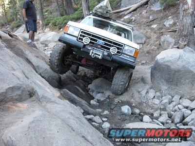 1991 Ford Bronco - This 1991 Ford Bronco is tackling a challenging off-road course on a mountainside.