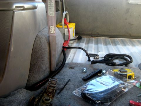 1996 Ford Bronco - The interior of a 1996 Ford Bronco shows an Optima battery and various wiring components, suggesting aftermarket electrical upgrades.