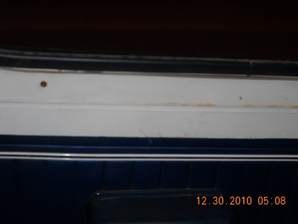 Dark blue interior panel with white trim and a date stamp