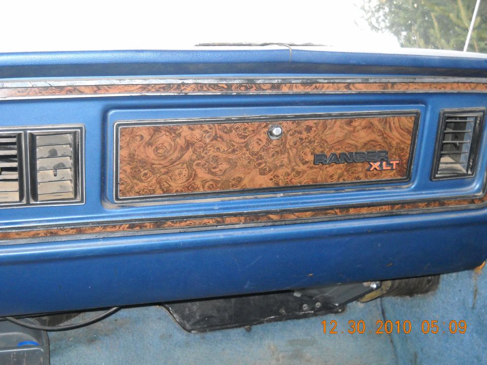 Interior dashboard with woodgrain trim and RANGER XLT badge
