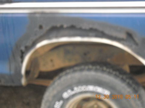 1982 Ford Bronco - Rust damage is visible on the wheel well and fender of this vehicle.