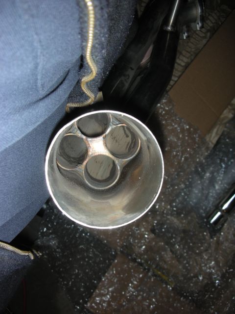 2004 Ford Crown Victoria - The image shows the end of a custom exhaust system with multiple outlets.